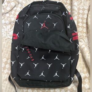 Jordan Black Backpack with White Jumpman Pattern and Red Logo